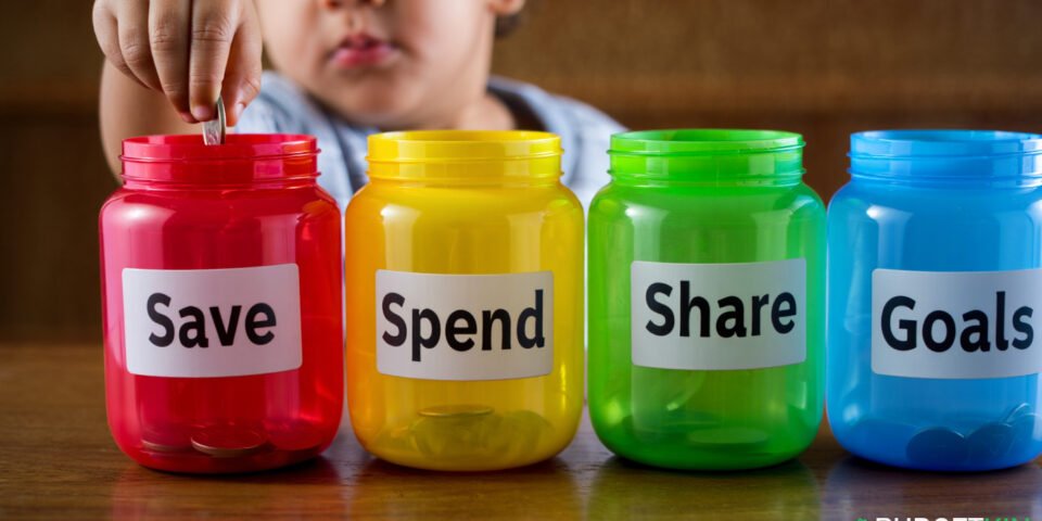 Colourful piggy bank jars labelled with key financial terms for children. money words for kids