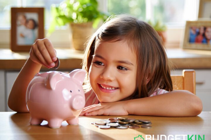 Smiling child placing coins into a piggy bank at a table, symbolising saving money and good financial habits. Pocket Money Tips