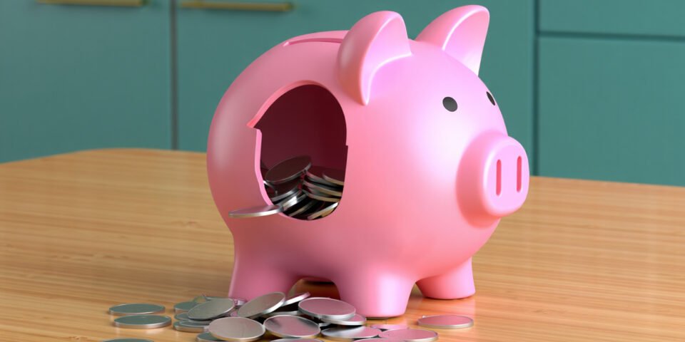 Leaking piggy bank symbolising budget busters.
