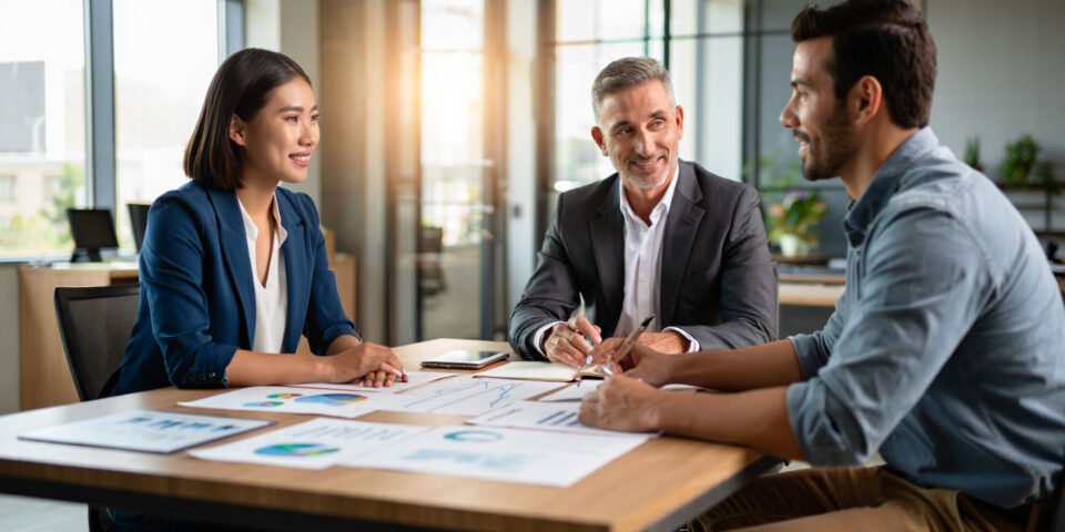 Young couple planning retirement with advisor
