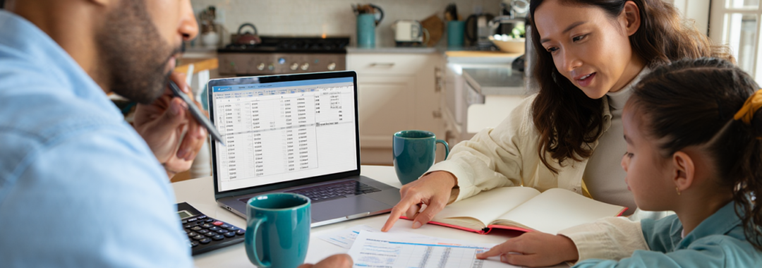 Family calculating monthly household income for a family budget in the UK