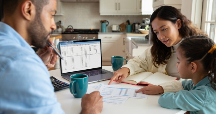 Family calculating monthly household income for a family budget in the UK