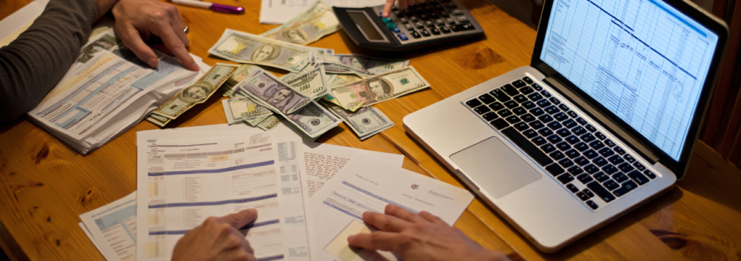 Family planning budget at kitchen table Saving Money for Families UK, The Ultimate Guide