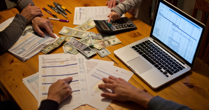 Family planning budget at kitchen table Saving Money for Families UK, The Ultimate Guide