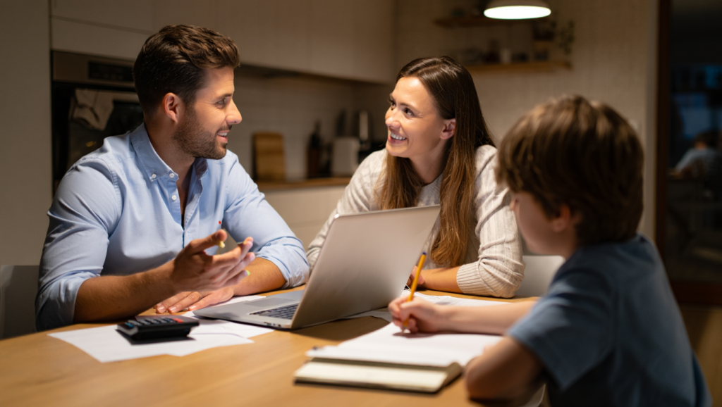 Parents reviewing household income while planning a family budget